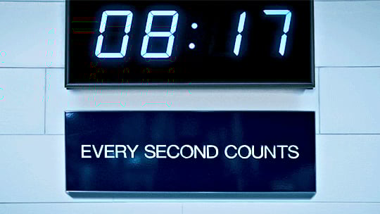 Clock with a sign underneath that says every second counts